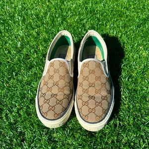 Gucci slip on shoes. Canvas with red leather bottom.